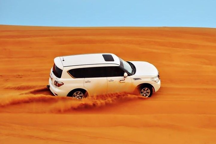 Experience the exhilarating ride across the golden dunes where adventure meets the stunning desert landscape creating unforgettable memories amidst endless sandy vistas.